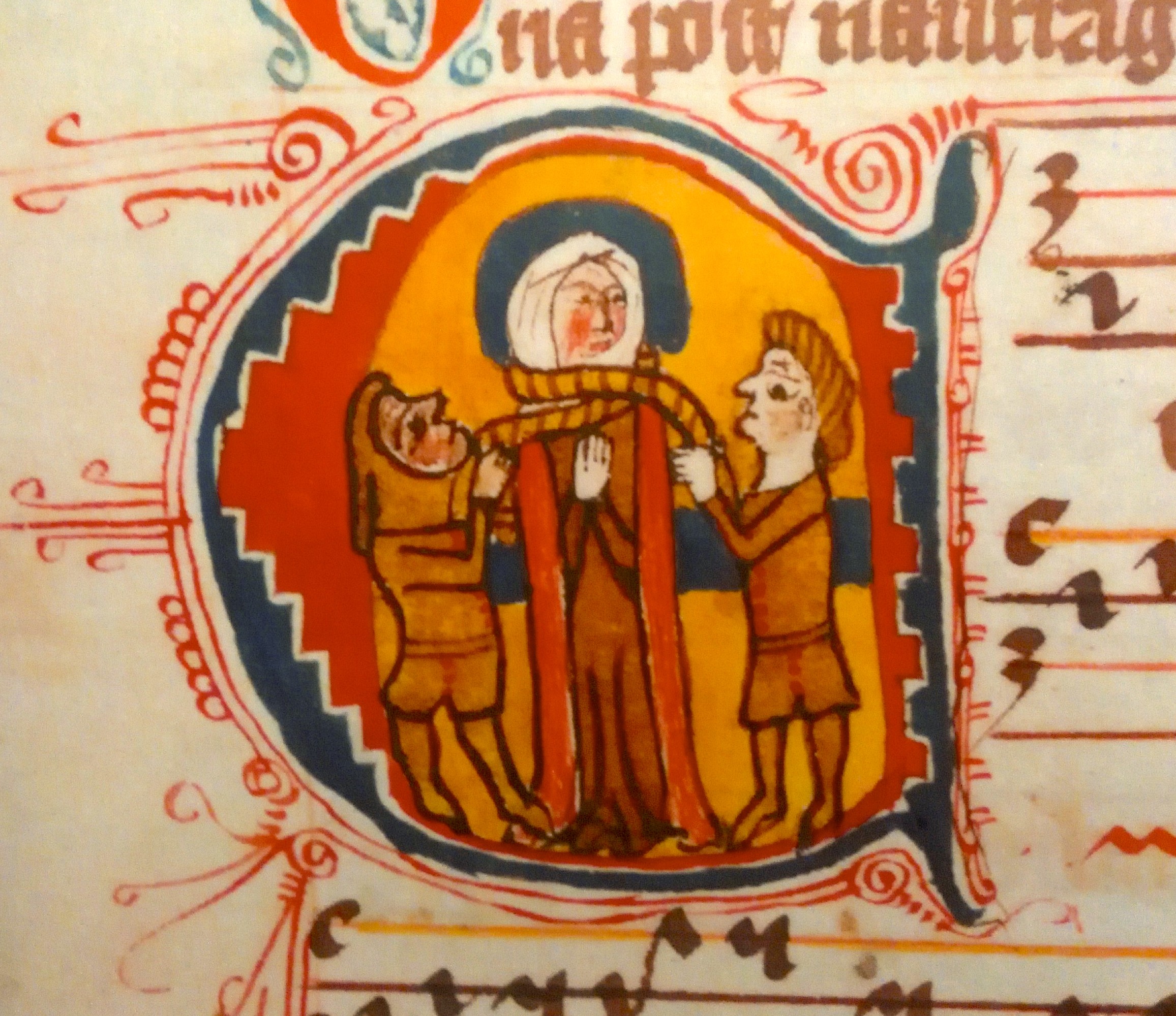 Uprostřed kněžna Ludmila škrcená provazem Blíženci, vlevo Tuna (Stín) a vpravo Komon (Světlo). Zdobená iniciála v Corpus officium, 14. století. Foto J. Cinert z výstavy Kniha a závoj v pražském Klementinu. Ludmila_iniciala